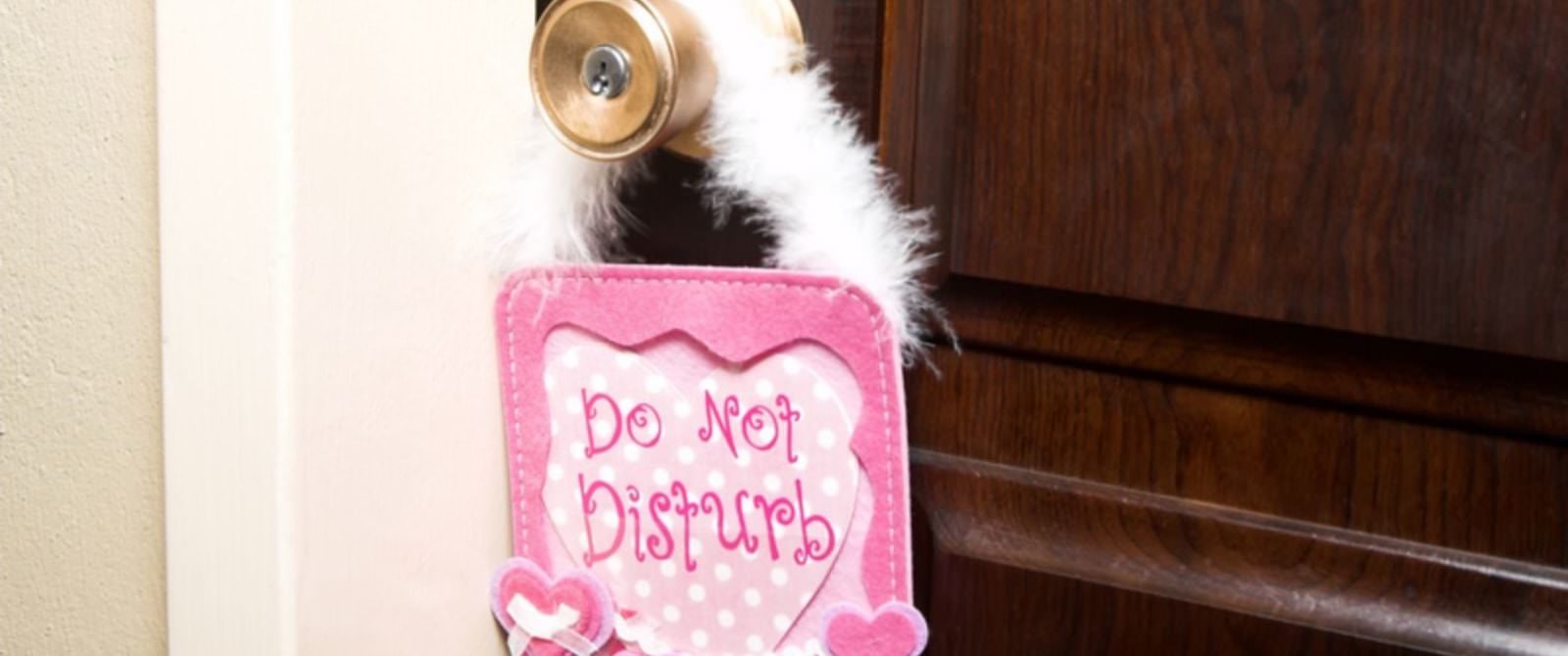 Pink door hanger with Do Not Disturb
